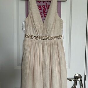 Elegant Cream Sleeveless Dress with Embellished Waist